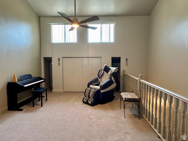 160 W 100 S, Fillmore, UT 84631 - sitting room with a ceiling fan, carpet flooring, a towering ceiling, baseboards, and an upstairs landing