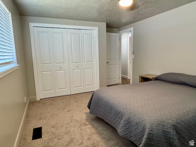 160 W 100 S, Fillmore, UT 84631 - bedroom featuring a closet, carpet, baseboards, and a textured ceiling