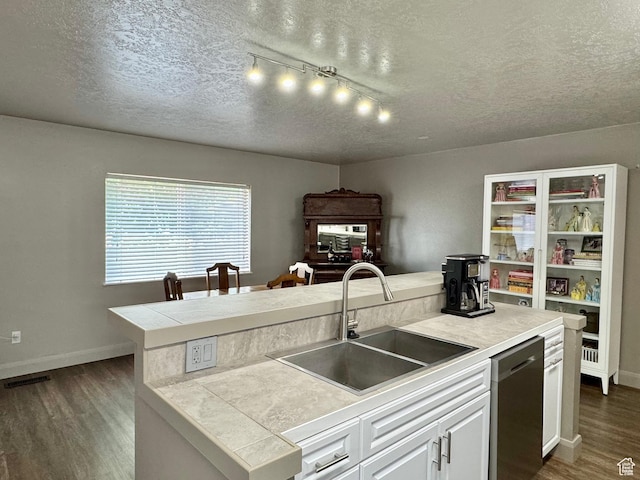 160 W 100 S, Fillmore, UT 84631 - kitchen with stainless steel dishwasher, a textured ceiling, a sink, dark wood-type flooring, and white cabinetry