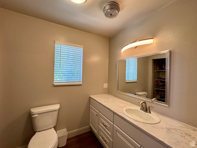 160 W 100 S, Fillmore, UT 84631 - bathroom with toilet, vanity, wood finished floors, and baseboards