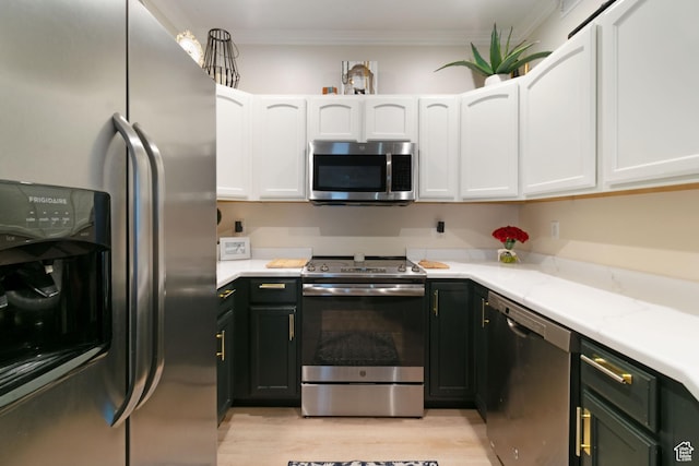 1559 W Alsace Way, West Valley City, UT 84119 - kitchen featuring stainless steel appliances, white cabinets, light wood-style floors, and ornamental molding