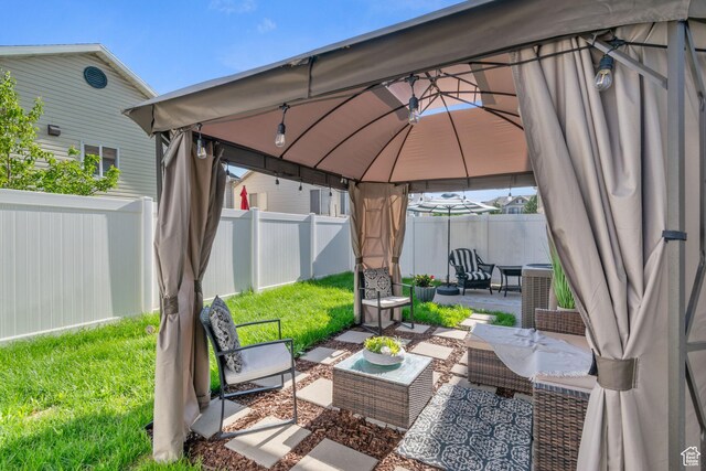 1559 W Alsace Way, West Valley City, UT 84119 - fenced backyard featuring an outdoor living space, a patio, a gazebo, and central AC unit