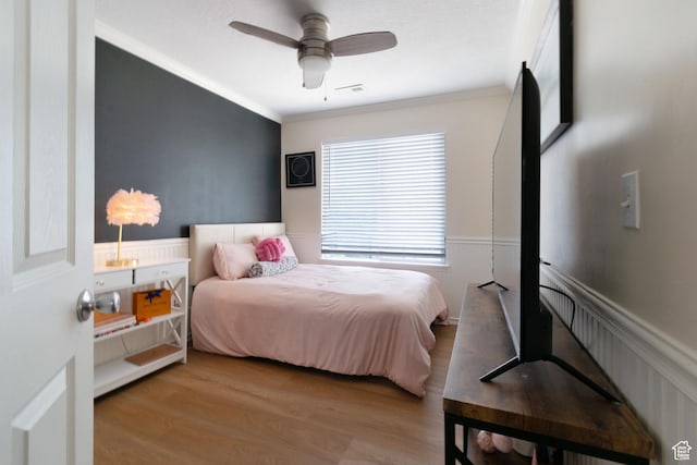 1559 W Alsace Way, West Valley City, UT 84119 - bedroom with crown molding, wood finished floors, wainscoting, and ceiling fan