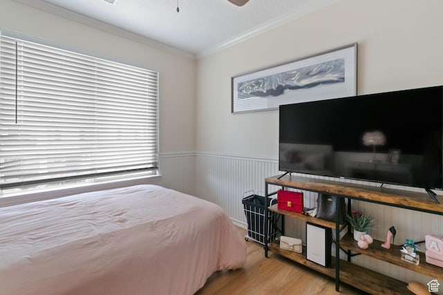 1559 W Alsace Way, West Valley City, UT 84119 - bedroom featuring wood finished floors, multiple windows, crown molding, and a wainscoted wall