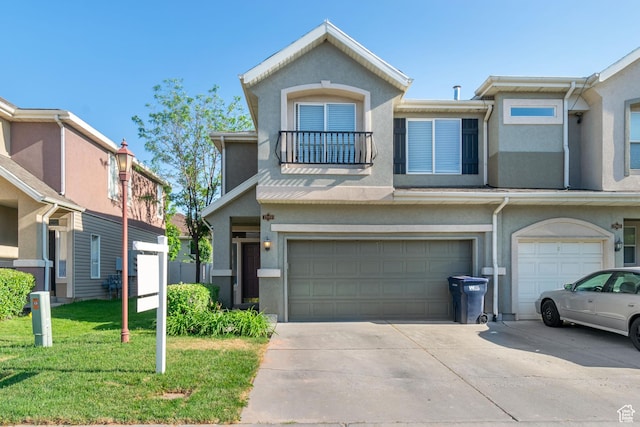 1559 W Alsace Way, West Valley City, UT 84119 - townhome / multi-family property featuring an attached garage, stucco siding, driveway, and a front yard