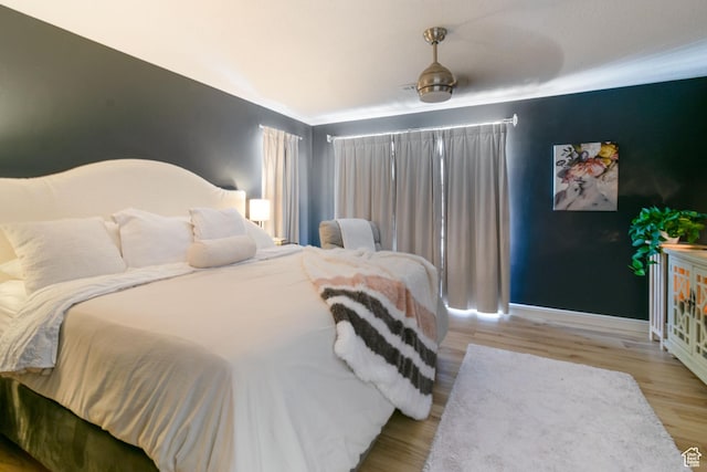1559 W Alsace Way, West Valley City, UT 84119 - bedroom featuring baseboards and wood finished floors