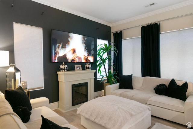 1559 W Alsace Way, West Valley City, UT 84119 - living area featuring light wood-style floors, ornamental molding, a glass covered fireplace, and baseboards