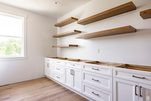 1928 E 540 S, Heber City, UT 84032 - kitchen featuring open shelves, white cabinets, light wood-type flooring, and a textured ceiling