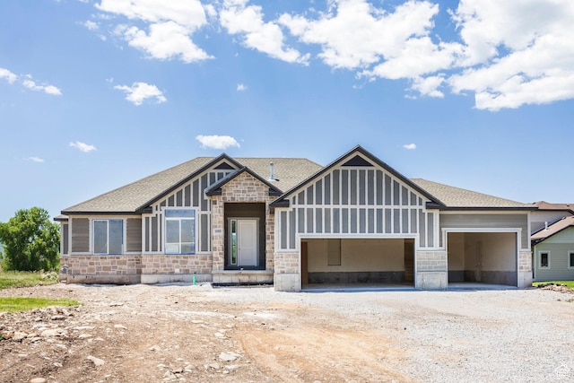 1928 E 540 S Unit 64, Heber City, UT 84032 - view of front of home featuring stone siding, a garage, driveway, and a shingled roof