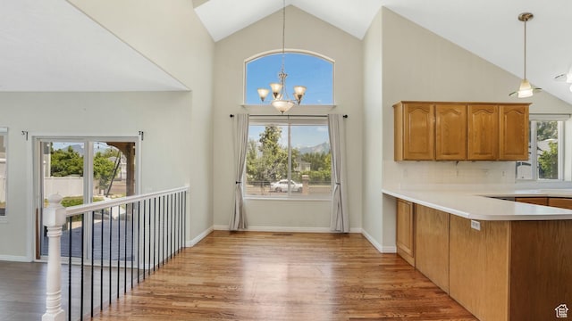 9677 S Iron Gate Rd, South Jordan, UT 84095 - entrance foyer featuring a chandelier, healthy amount of natural light, light wood finished floors, high vaulted ceiling, and baseboards