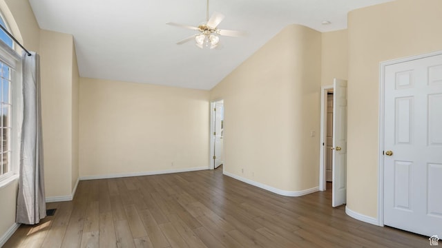 9677 S Iron Gate Rd, South Jordan, UT 84095 - spare room with ceiling fan, wood finished floors, baseboards, and high vaulted ceiling