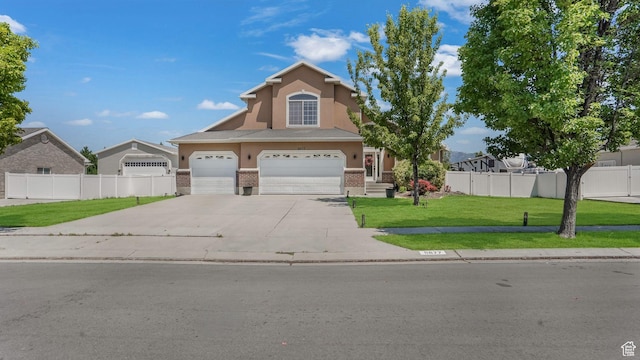 9677 S Iron Gate Rd, South Jordan, UT 84095 - traditional-style home featuring brick siding, stucco siding, driveway, and an attached garage