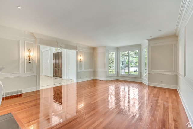 4234 N Vintage Cir, Provo, UT 84604 - unfurnished living room with a decorative wall, crown molding, and light wood-style floors
