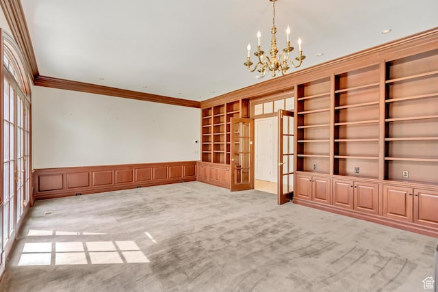 4234 N Vintage Cir, Provo, UT 84604 - spare room featuring french doors, crown molding, a chandelier, light carpet, and wainscoting