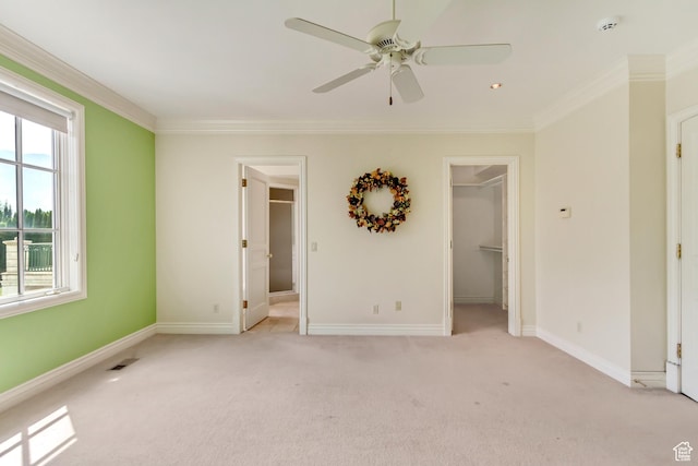 4234 N Vintage Cir, Provo, UT 84604 - unfurnished bedroom with a spacious closet, light carpet, crown molding, baseboards, and a closet