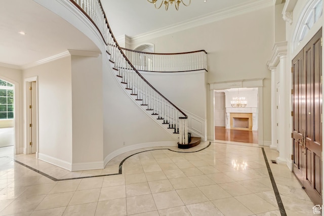 4234 N Vintage Cir, Provo, UT 84604 - entrance foyer featuring inlaid floor details, a chandelier, stairway, crown molding, and baseboards