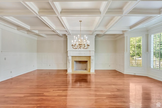 4234 N Vintage Cir, Provo, UT 84604 - unfurnished living room with a chandelier, light wood-style flooring, coffered ceiling, a premium fireplace, and a decorative wall