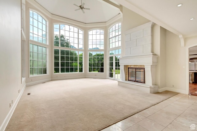 4234 N Vintage Cir, Provo, UT 84604 - unfurnished living room featuring ceiling fan, healthy amount of natural light, a fireplace, a towering ceiling, and crown molding