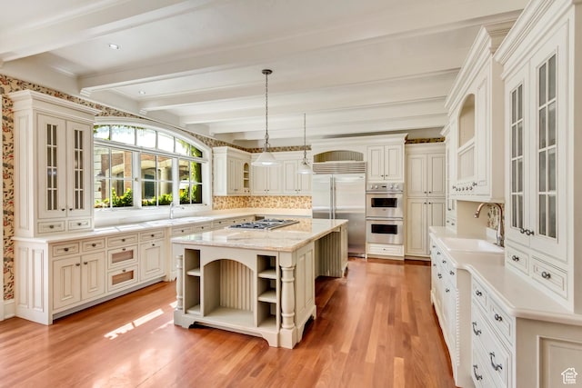 4234 N Vintage Cir, Provo, UT 84604 - kitchen featuring open shelves, appliances with stainless steel finishes, a sink, light wood finished floors, and a kitchen island