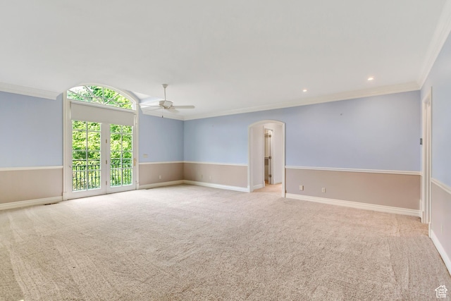 4234 N Vintage Cir, Provo, UT 84604 - spare room featuring arched walkways, crown molding, ceiling fan, carpet floors, and baseboards