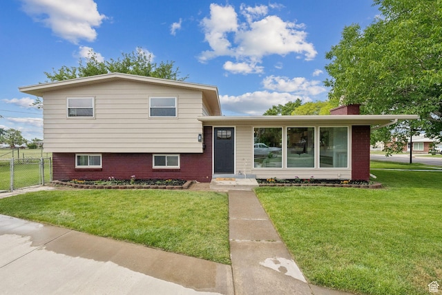 4194 S Bennion Rd, Taylorsville, UT 84129 - split level home with a chimney and brick siding