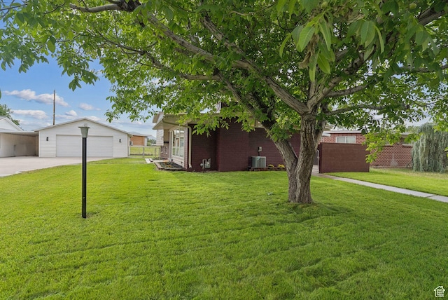 4194 S Bennion Rd, Taylorsville, UT 84129 - view of yard featuring an outbuilding, central AC, and driveway