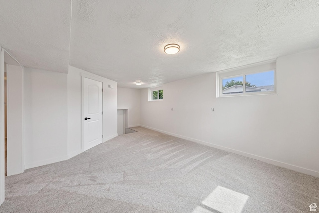 4194 S Bennion Rd, Taylorsville, UT 84129 - below grade area featuring a textured ceiling, carpet floors, and baseboards