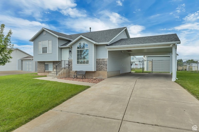 4060 W 4950 S, Roy, UT 84067 - split level home with brick siding, driveway, a carport, roof with shingles, and an outbuilding