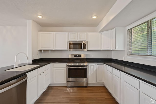 1389 S Alpine Way, Provo, UT 84606 - kitchen featuring appliances with stainless steel finishes, a sink, dark countertops, and recessed lighting