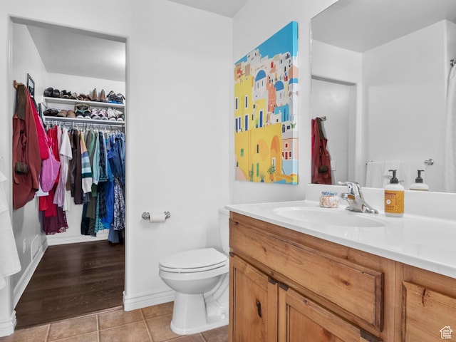 518 S 2150 W Unit 202, Pleasant Grove, UT 84062 - bathroom featuring vanity, tile patterned flooring, toilet, and a spacious closet