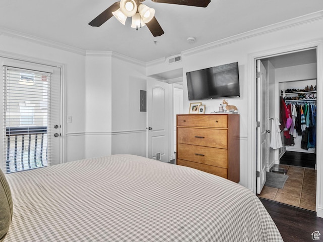 518 S 2150 W Unit 202, Pleasant Grove, UT 84062 - bedroom with ornamental molding, dark wood-type flooring, a ceiling fan, a walk in closet, and a closet