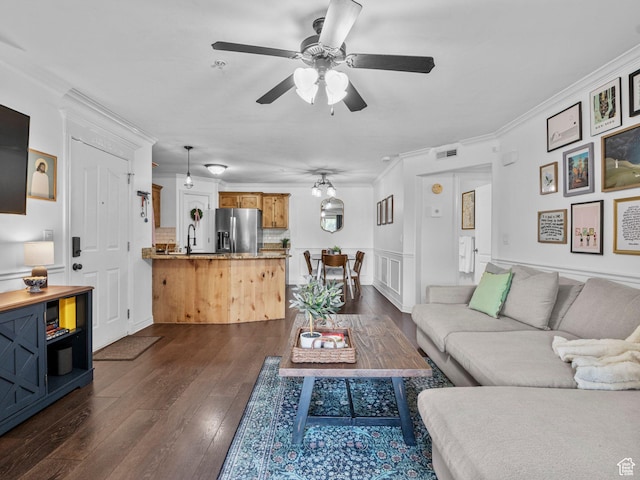 518 S 2150 W Unit 202, Pleasant Grove, UT 84062 - living area with ceiling fan, ornamental molding, dark wood finished floors, and wainscoting