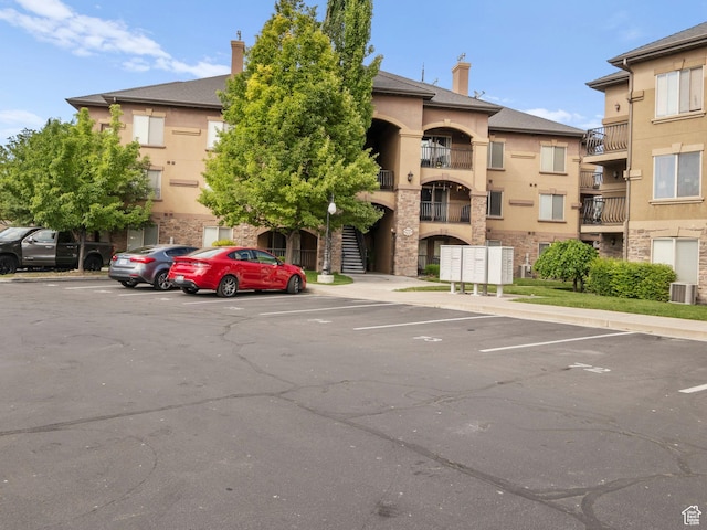 518 S 2150 W Unit 202, Pleasant Grove, UT 84062 - view of building exterior with uncovered parking and central AC unit