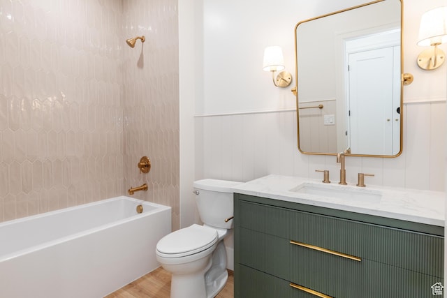 435 E 200 N, Millville, UT 84326 - full bath featuring vanity, toilet, shower / tub combination, a wainscoted wall, and wood finished floors