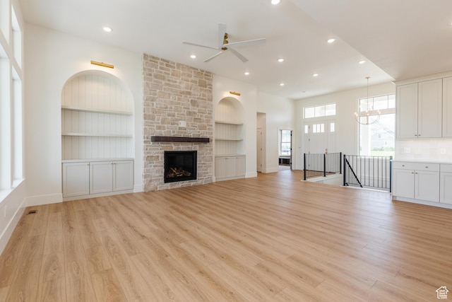435 E 200 N, Millville, UT 84326 - unfurnished living room featuring a ceiling fan, built in features, light wood-style floors, baseboards, and recessed lighting