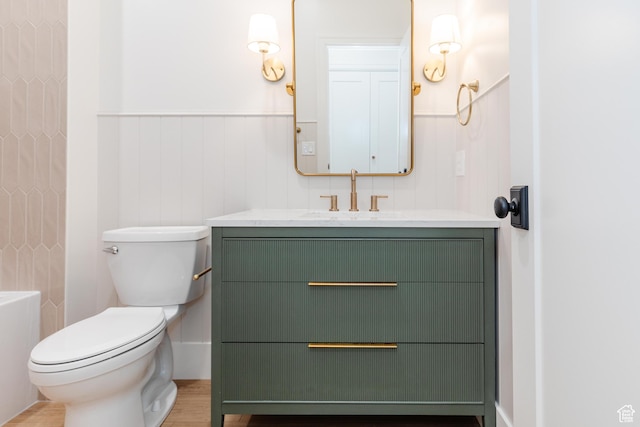435 E 200 N, Millville, UT 84326 - bathroom featuring vanity, toilet, wainscoting, and wood finished floors