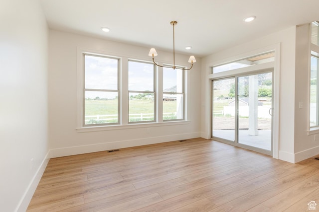 435 E 200 N, Millville, UT 84326 - unfurnished dining area with baseboards, light wood finished floors, a chandelier, and recessed lighting