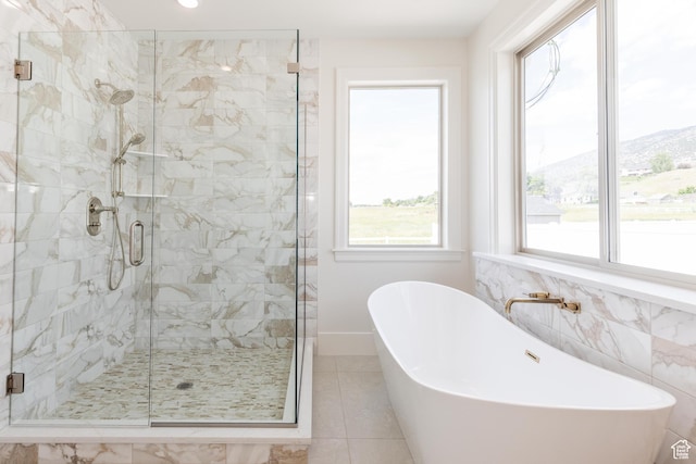 435 E 200 N, Millville, UT 84326 - full bath featuring a stall shower, a freestanding tub, and tile patterned flooring