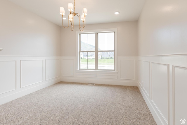 435 E 200 N, Millville, UT 84326 - spare room with a decorative wall, a chandelier, light colored carpet, wainscoting, and recessed lighting