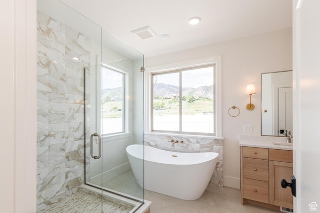 435 E 200 N, Millville, UT 84326 - bathroom with a freestanding bath, vanity, a stall shower, tile patterned flooring, and a mountain view