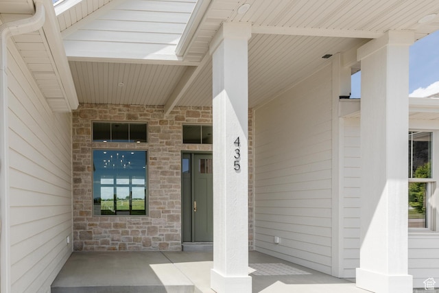 435 E 200 N, Millville, UT 84326 - view of exterior entry with stone siding and covered porch