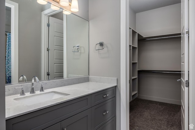 1861 N Mountain View Dr, Washington, UT 84780 - bathroom featuring vanity and a walk in closet