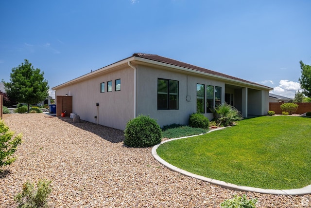 1861 N Mountain View Dr, Washington, UT 84780 - view of side of property featuring stucco siding and a lawn