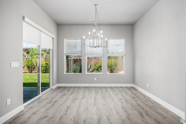 1861 N Mountain View Dr, Washington, UT 84780 - unfurnished dining area with a chandelier, wood finished floors, and baseboards