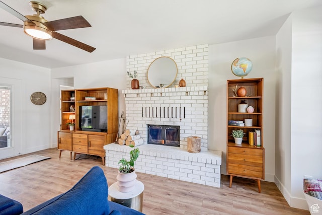 960 N E View Dr, Alpine, UT 84004 - living room featuring wood finished floors, a ceiling fan, a fireplace, and baseboards
