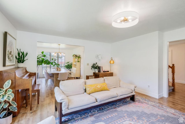 960 N E View Dr, Alpine, UT 84004 - living room with light wood-style floors, a chandelier, and baseboards
