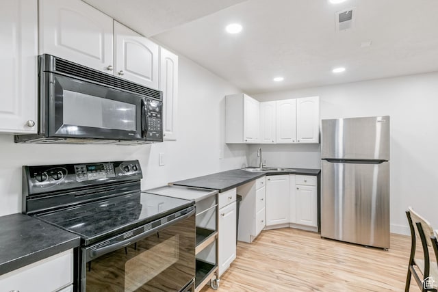 960 N E View Dr, Alpine, UT 84004 - kitchen featuring black appliances, a sink, white cabinetry, light wood-type flooring, and dark countertops