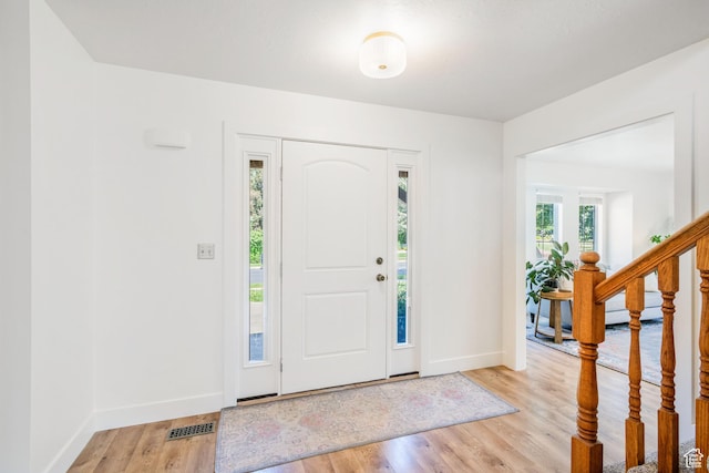960 N E View Dr, Alpine, UT 84004 - entrance foyer with baseboards, light wood-style flooring, and stairway