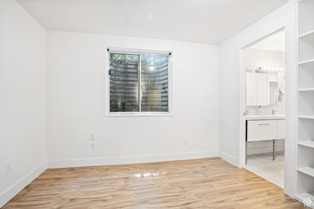 960 N E View Dr, Alpine, UT 84004 - unfurnished bedroom featuring light wood-type flooring, baseboards, and ensuite bathroom