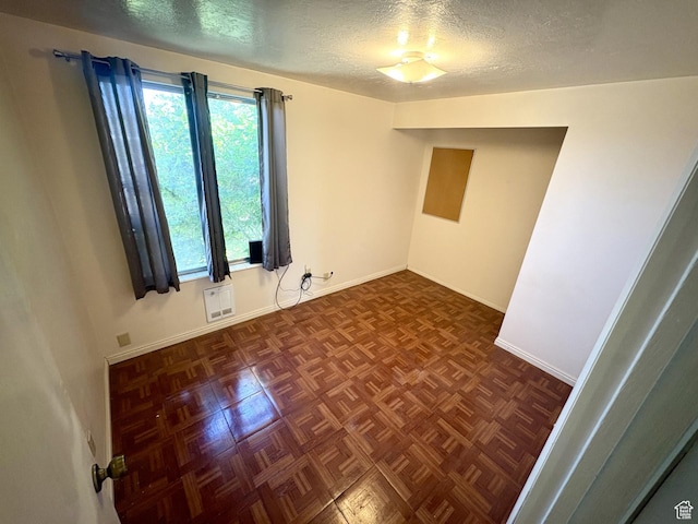 391 N 100 W, Delta, UT 84624 - spare room with a textured ceiling and baseboards